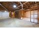 Unfinished basement with exposed wood framing, concrete floors, and visible ductwork, offering potential for customization at 5405 Preserve Cir, Johns Creek, GA 30005