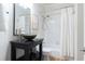 Bathroom featuring modern vanity and shower-tub combination with tiled walls at 5405 Preserve Cir, Johns Creek, GA 30005