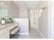 Bathroom with granite countertop vanity, tiled glass shower, and access to the walk-in closet at 5405 Preserve Cir, Johns Creek, GA 30005