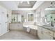 Bathroom features a soaking tub, dual sinks, granite countertops and custom tiling at 5405 Preserve Cir, Johns Creek, GA 30005