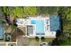 Aerial view of the community pool with a full basketball court surrounded by trees at 5405 Preserve Cir, Johns Creek, GA 30005