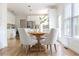 Open-concept eat-in kitchen with hardwood floors and stainless steel appliances at 5405 Preserve Cir, Johns Creek, GA 30005