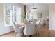 Dining room including a vaulted ceiling and large window letting in natural light at 5405 Preserve Cir, Johns Creek, GA 30005