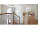 Upstairs foyer featuring hardwood flooring, chandelier, and staircase at 5405 Preserve Cir, Johns Creek, GA 30005