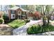 Stately brick home boasting a meticulously landscaped front yard and a welcoming driveway at 5405 Preserve Cir, Johns Creek, GA 30005