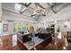 Relaxing clubhouse lounge with leather couches, wood floors, and stylish lighting at 5405 Preserve Cir, Johns Creek, GA 30005