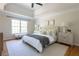 Bright main bedroom suite with vaulted ceilings, fan, large windows, and neutral decor at 5405 Preserve Cir, Johns Creek, GA 30005