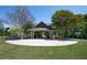 Community pavilion with seating surrounded by mature trees and landscaping at 5405 Preserve Cir, Johns Creek, GA 30005