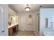 Large bathroom with dual sink vanity, framed mirrors, and a tiled floor at 542 Simonton Ridge Trl, Lawrenceville, GA 30045