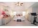 Spacious main bedroom with tray ceiling, carpet, and large windows for natural light at 542 Simonton Ridge Trl, Lawrenceville, GA 30045