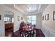 Formal dining room with a coffered ceiling and an elegant chandelier at 542 Simonton Ridge Trl, Lawrenceville, GA 30045