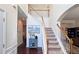 Spacious foyer with hardwood floors, staircase, and classic decor at 542 Simonton Ridge Trl, Lawrenceville, GA 30045