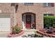 Close-up of front door with wreath and colorful landscaping at 542 Simonton Ridge Trl, Lawrenceville, GA 30045