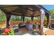 Gazebo featuring outdoor seating and a grill, perfect for entertaining in your own backyard at 542 Simonton Ridge Trl, Lawrenceville, GA 30045