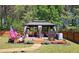 Backyard gazebo featuring outdoor seating and a grill, set on a well-maintained deck at 542 Simonton Ridge Trl, Lawrenceville, GA 30045