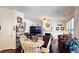 Open living room with a fireplace, a ceiling fan, and hardwood floors at 542 Simonton Ridge Trl, Lawrenceville, GA 30045