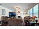 Cozy living room featuring a fireplace, large TV, and comfortable seating at 542 Simonton Ridge Trl, Lawrenceville, GA 30045