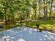 Back deck with outdoor seating and decorative flowers; perfect for entertaining at 1835 Penrose Ct, Powder Springs, GA 30127