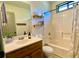 Bathroom with a single sink vanity and a shower/tub combination at 1835 Penrose Ct, Powder Springs, GA 30127
