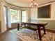 Bright dining room featuring a large table, bench seating, and wainscoting at 1835 Penrose Ct, Powder Springs, GA 30127