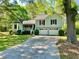 Charming home featuring an attached two car garage and a well-maintained front yard at 1835 Penrose Ct, Powder Springs, GA 30127