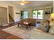 Inviting living room featuring neutral tones, ceiling fan, and plenty of natural light at 1835 Penrose Ct, Powder Springs, GA 30127