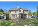Backyard featuring a well-maintained lawn, patio area, fenced perimeter, and exterior home view at 2023 Reserve Pkwy, Mcdonough, GA 30253