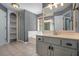 Bathroom featuring a built-in shelf storage, bathtub, glass shower and large vanity with drawers at 2023 Reserve Pkwy, Mcdonough, GA 30253