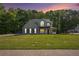 Charming two-story home boasts a beautifully landscaped front yard and inviting front porch at 2023 Reserve Pkwy, Mcdonough, GA 30253
