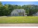 Charming two-story home boasts a beautifully landscaped front yard and inviting front porch at 2023 Reserve Pkwy, Mcdonough, GA 30253