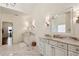 Bright bathroom featuring dual vanity sinks, marble countertop, and modern finishes at 2199 Tayside Nw Xing, Kennesaw, GA 30152
