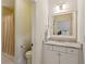 Bathroom featuring a vanity with drawers, a marble countertop, and a toilet behind an opened door at 2199 Tayside Nw Xing, Kennesaw, GA 30152