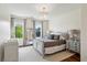 Bright bedroom with natural light, stylish furnishings, and dark hardwood floors offering a restful ambiance at 2199 Tayside Nw Xing, Kennesaw, GA 30152