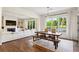 Open-concept dining room area with hardwood floors and view to living room and outdoor living space at 2199 Tayside Nw Xing, Kennesaw, GA 30152