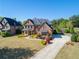 Beautiful brick home with a well-manicured lawn and long driveway leading to the front entrance at 2199 Tayside Nw Xing, Kennesaw, GA 30152