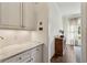 Bright hallway with built in cabinets, marble countertop, and hardwood floors at 2199 Tayside Nw Xing, Kennesaw, GA 30152