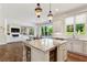Modern kitchen featuring marble countertops, stainless steel appliances, and open layout to living area at 2199 Tayside Nw Xing, Kennesaw, GA 30152