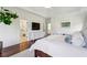 Bright main bedroom featuring hardwood floors, a large dresser, and ensuite bath at 2199 Tayside Nw Xing, Kennesaw, GA 30152