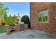 Outdoor kitchen with built-in grill, brick surround, and convenient patio space at 2199 Tayside Nw Xing, Kennesaw, GA 30152