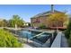 A backyard pool with a fence around it, a spa, and a lounge area, perfect for relaxation and entertainment at 2199 Tayside Nw Xing, Kennesaw, GA 30152