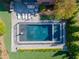 Aerial view of a fenced in luxurious pool with lounge chairs on the stone deck at 2199 Tayside Nw Xing, Kennesaw, GA 30152