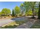 Beautiful street view with mature trees, manicured lawns and lush landscaping in an upscale neighborhood at 2199 Tayside Nw Xing, Kennesaw, GA 30152