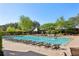 Inviting community swimming pool with lounge chairs and manicured landscaping on a sunny day at 2199 Tayside Nw Xing, Kennesaw, GA 30152