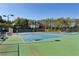 Well-maintained community tennis courts surrounded by lush greenery under a bright, clear sky at 2199 Tayside Nw Xing, Kennesaw, GA 30152
