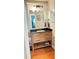Vanity with large mirror and updated fixtures enhances this well-lit powder room at 4025 Mcdowell Dr, Acworth, GA 30101