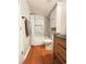 Updated bathroom features tile surround, built-in shelving, and modern fixtures at 4025 Mcdowell Dr, Acworth, GA 30101