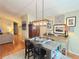 Inviting dining room setup with modern lighting and hardwood floors at 4025 Mcdowell Dr, Acworth, GA 30101