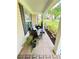 Inviting front porch offers comfortable seating and views of the well-manicured lawn at 4025 Mcdowell Dr, Acworth, GA 30101