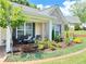 Inviting front porch with seating, enhanced by beautiful landscaping and stylish accents at 4025 Mcdowell Dr, Acworth, GA 30101
