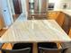 Close up on kitchen island featuring granite countertops and two chairs at 4025 Mcdowell Dr, Acworth, GA 30101